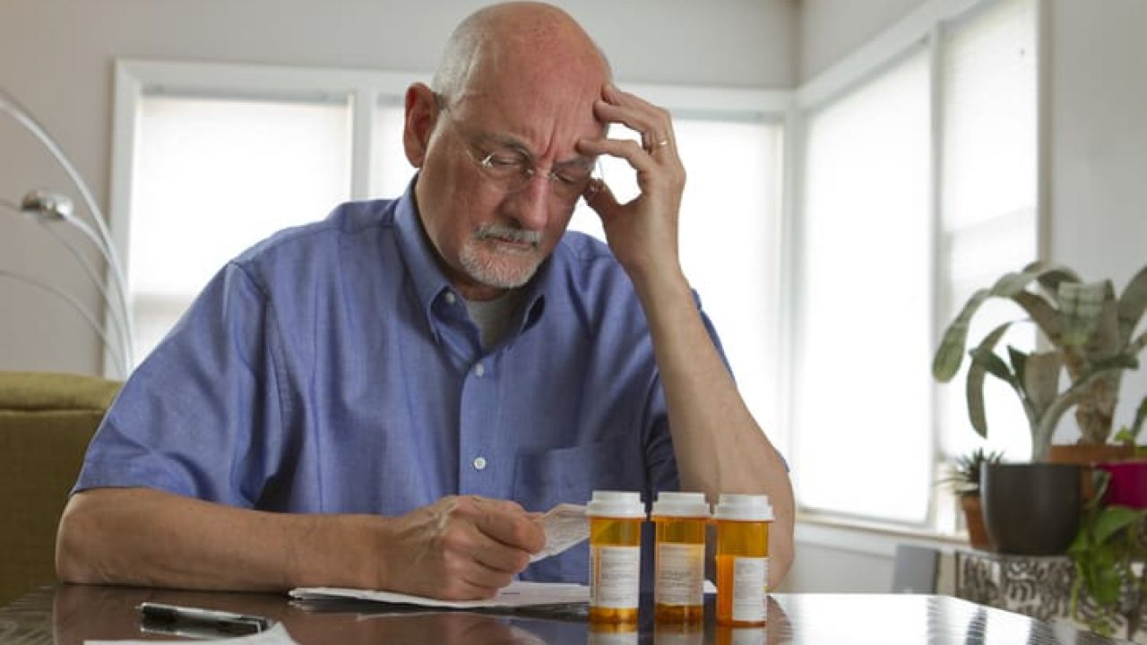 Older man with prescription medications